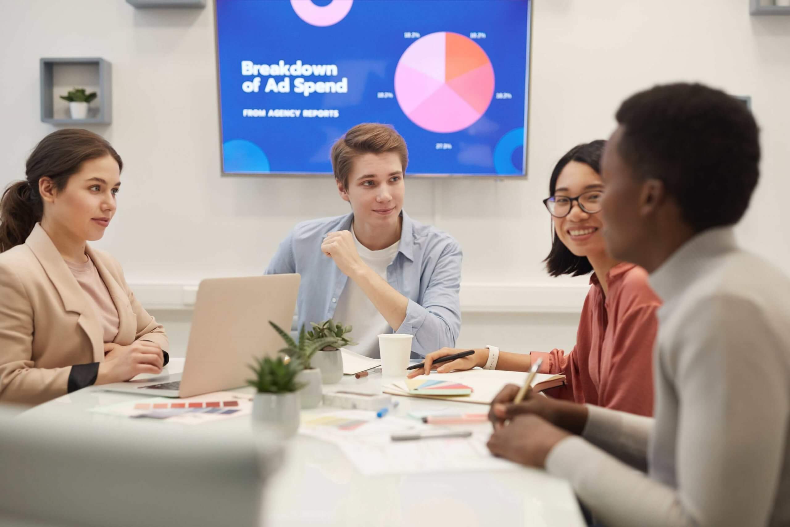 young people discussing marketing in meeting